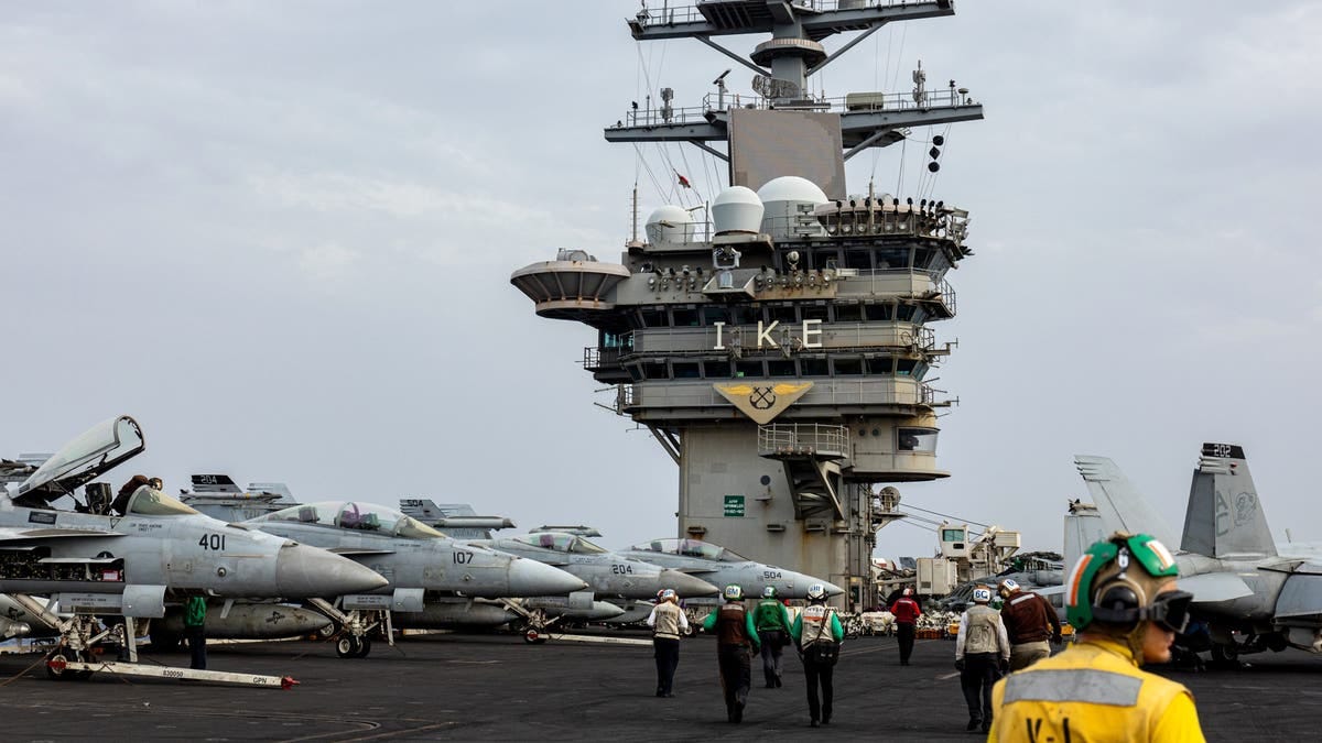 F/A-18 Super Hornet fighter jets on the flight deck of the USS Dwight D. Eisenhower aircraft carrier